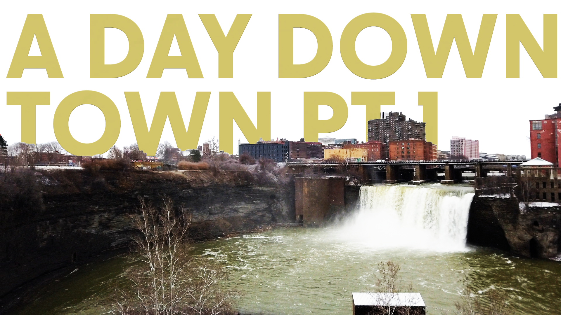 A landscape of Rochester, NY. Text reads 'A Day Downtown PT1'