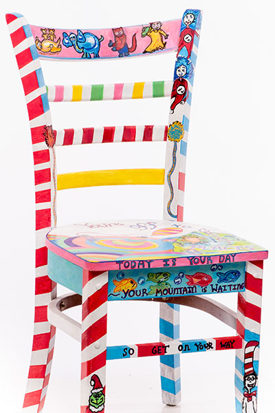 Dr. Seuss-themed chair, red and white stripes, blue and white stripes