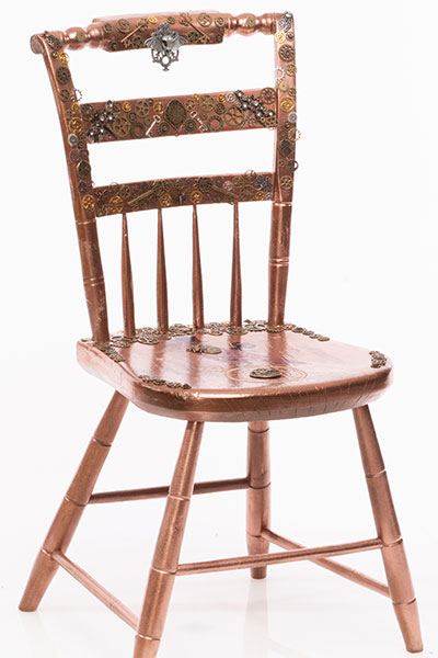 Cooper painted chair encrusted with various steampunk related accents