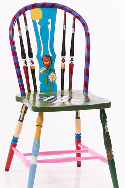 Small dining chair with "Alice in Wonderland" theme.