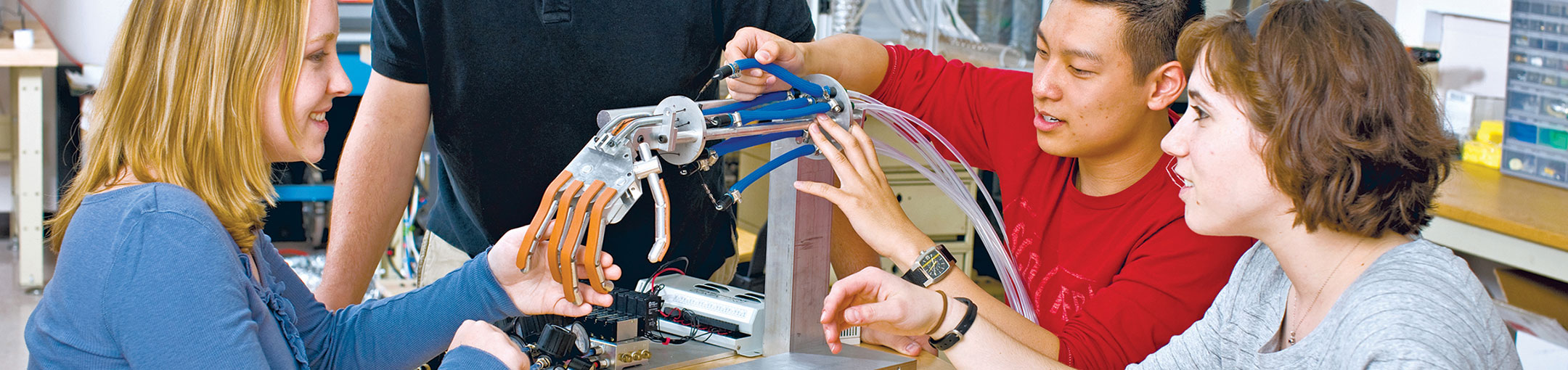 Students using a robotic hand