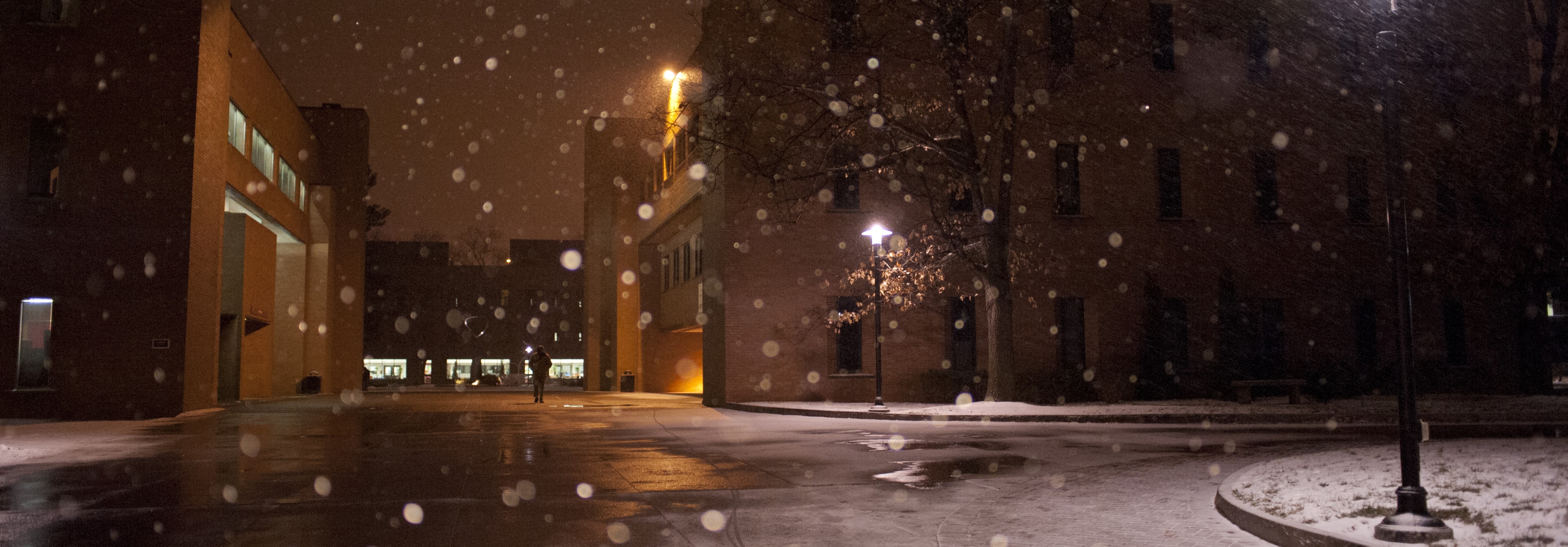 snowy night view of eastman hall