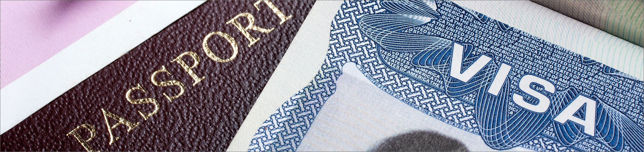 Close up of the top of a visa and passport.
