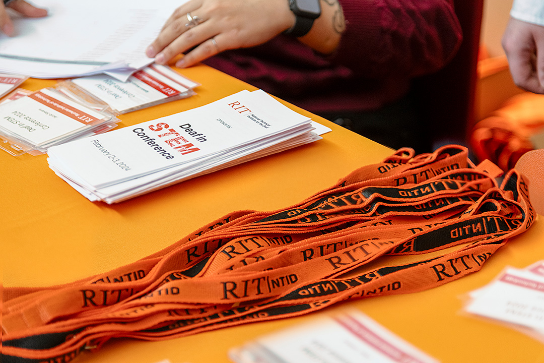Close-up shot of conference badges for attendees