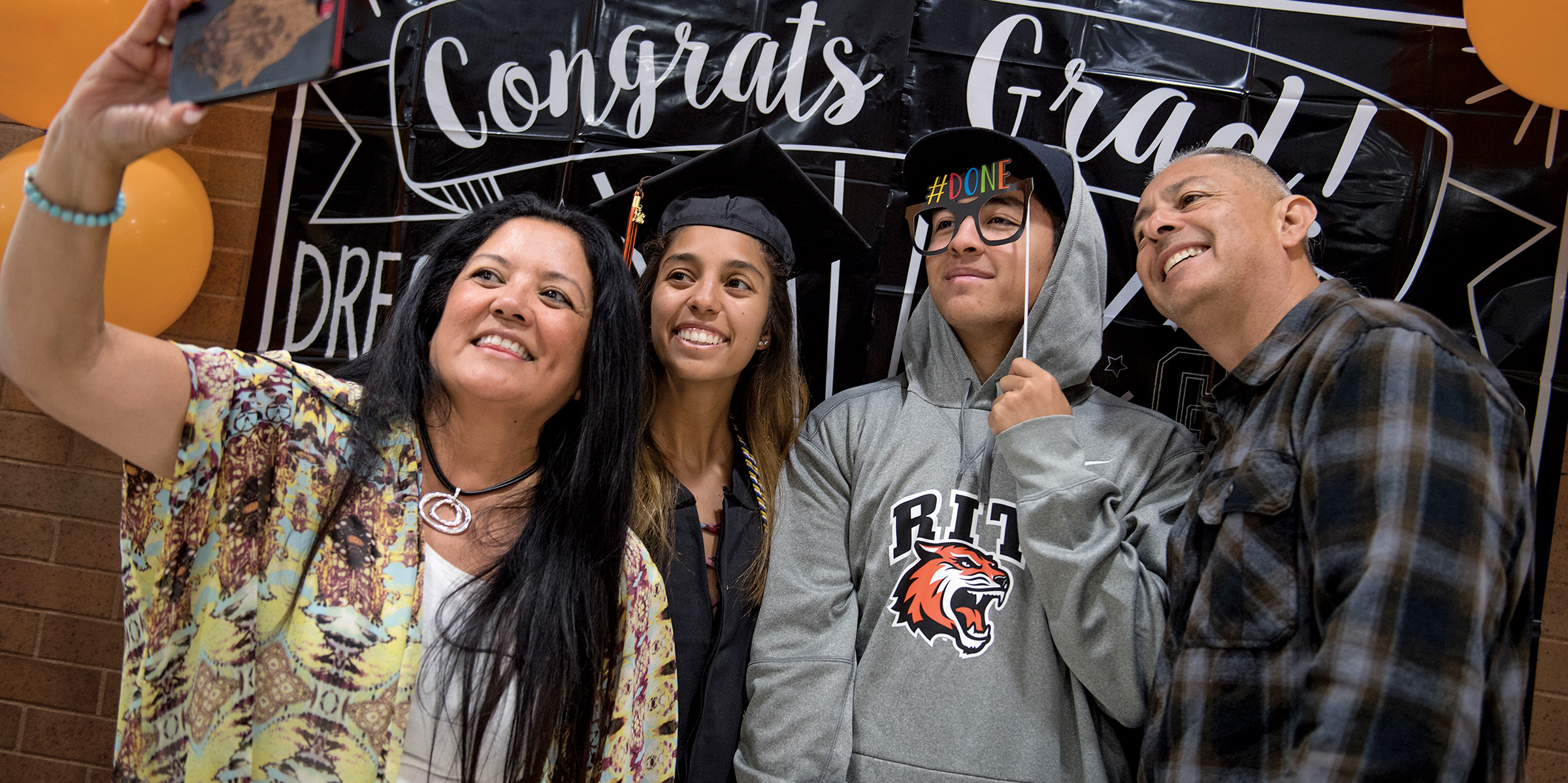 Parents and grads pose for selfie