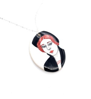 hand painted Ceramic Necklace with a stylized woman from the 1500s on it with red hair.