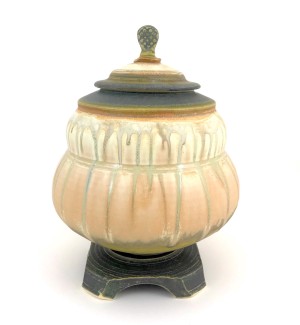 multicolored Hand Thrown Ceramic Lidded Vessel with dark colored base.