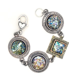 A bracelet with large square and circle shaped links with sparkly centers.