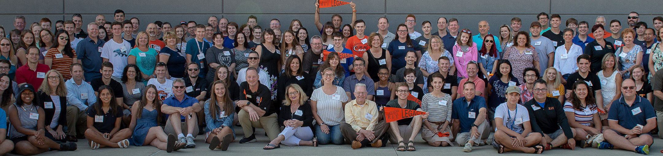A group of incoming RIT freshmen with their parents who also attended RIT