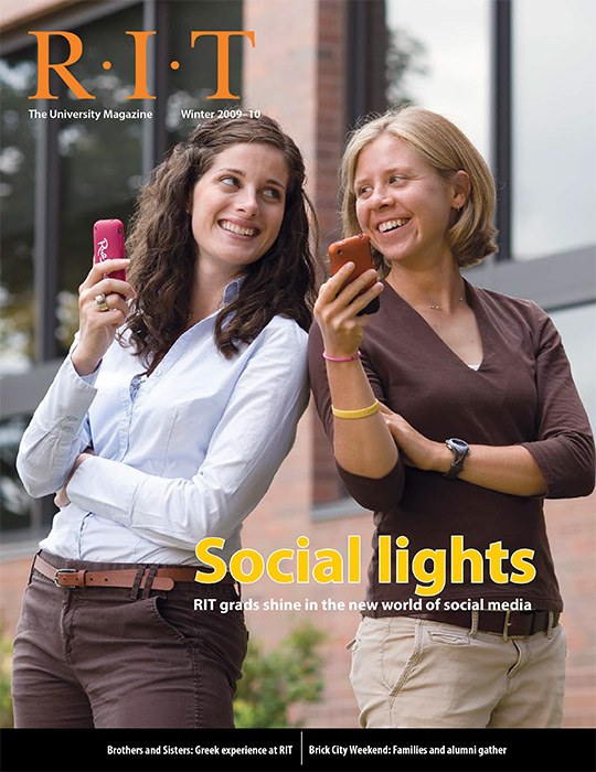 University Magazine cover featuring two women standing back-to-back holding up cellphones.
