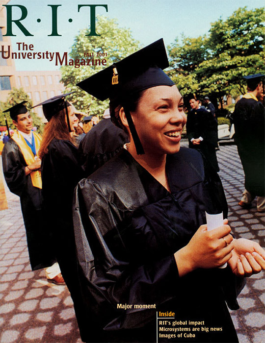 University Magazine cover featuring grads wearing caps and gowns standing outside.