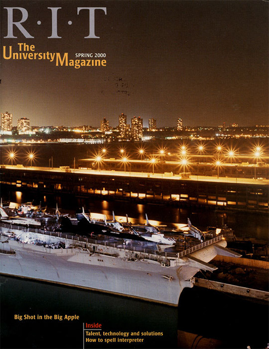 University Magazine cover featuring nighttime view of New York City harbor and skyline.