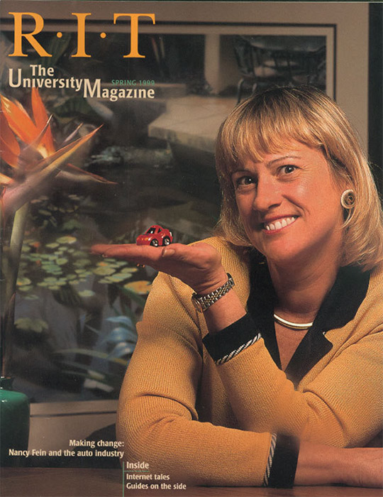 University Magazine cover featuring woman holding model car in her hand.