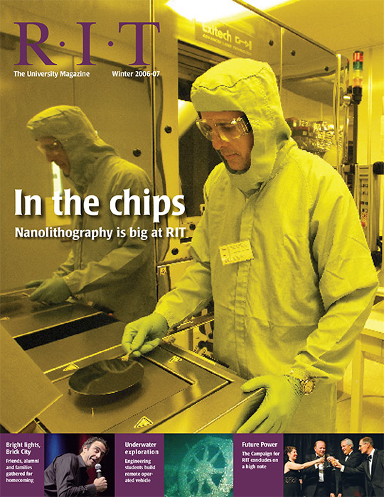 University Magazine cover featuring man in cleansuit holding semiconductor wafer.
