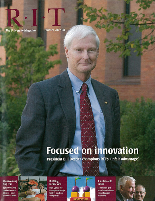 University Magazine cover featuring Bill Destler wearing suit and red tie.
