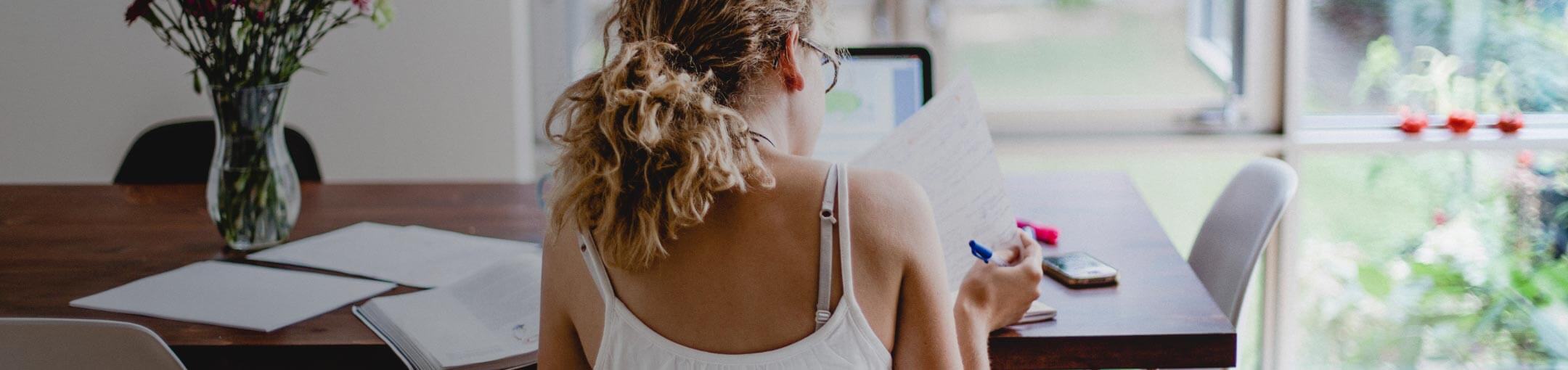 A person studying at a desk.