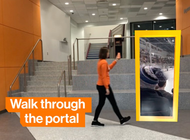 a student holds their phone up and walks through an augmented reality portal
