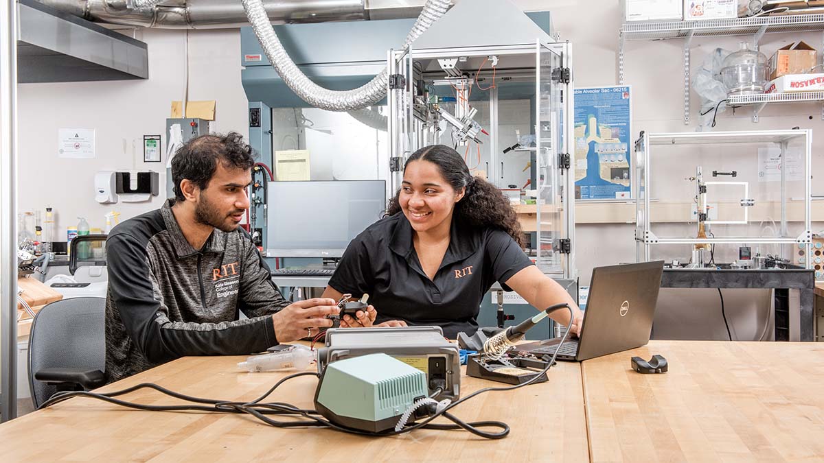 two students collaborating in a lab