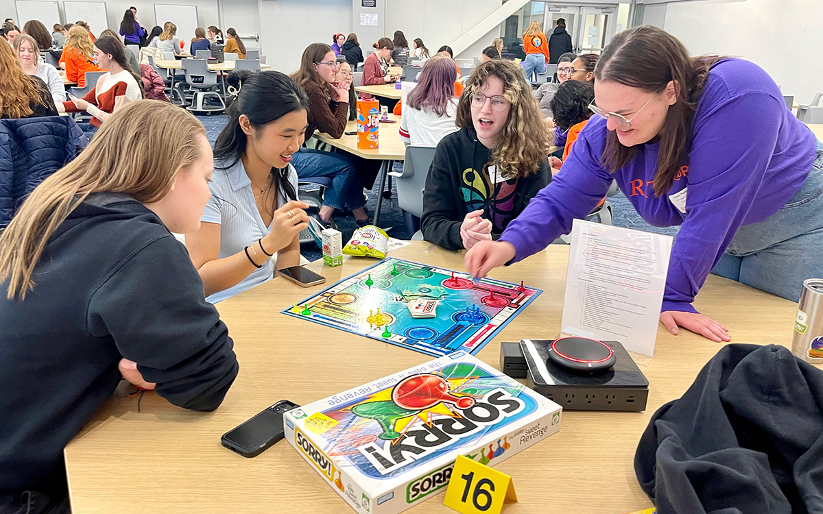 group of students playing a game at a table