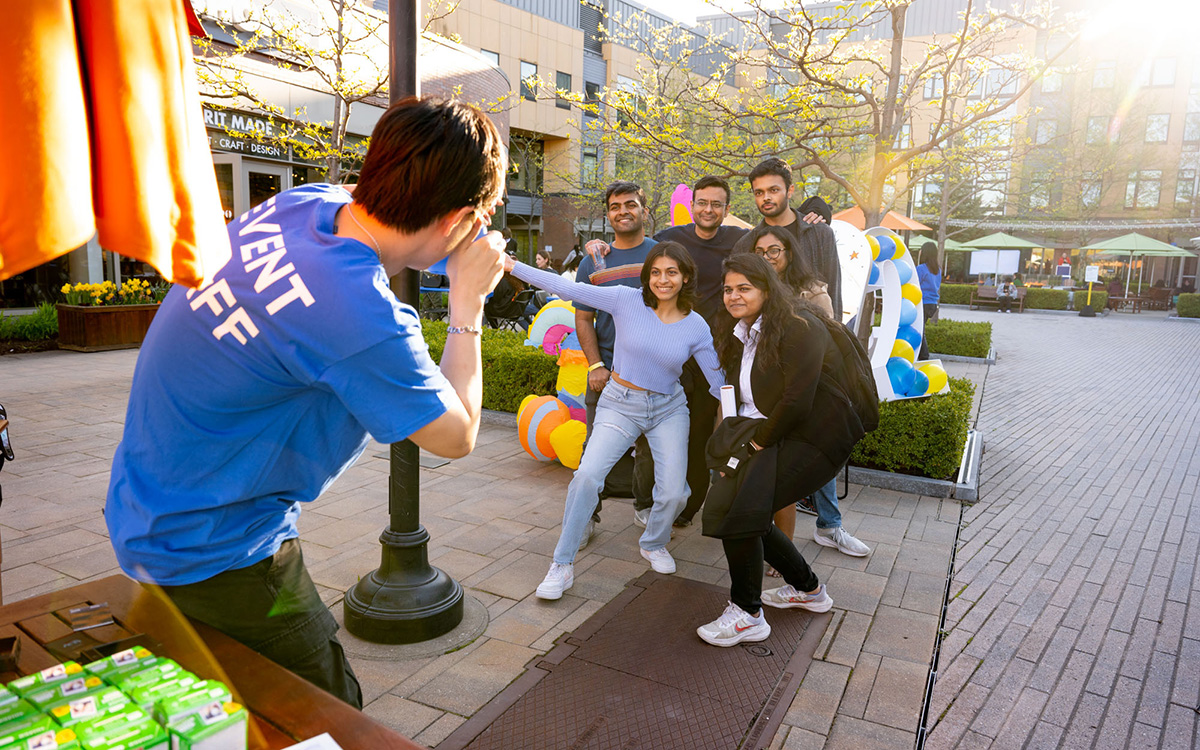 Student taking photo of another group of students