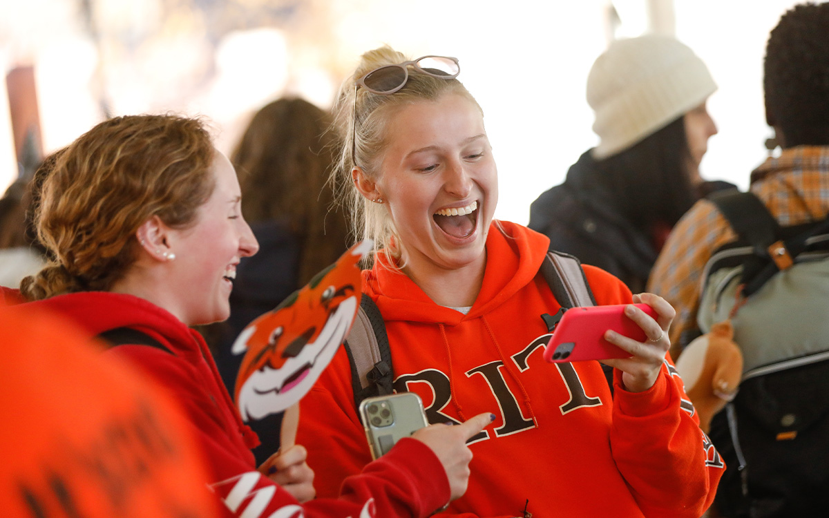 Two students with R I T gear on