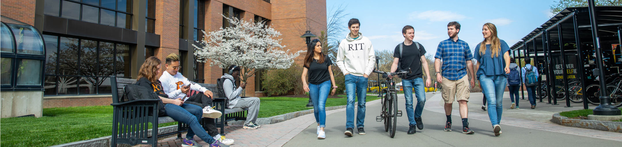 A group of students walking on campus.