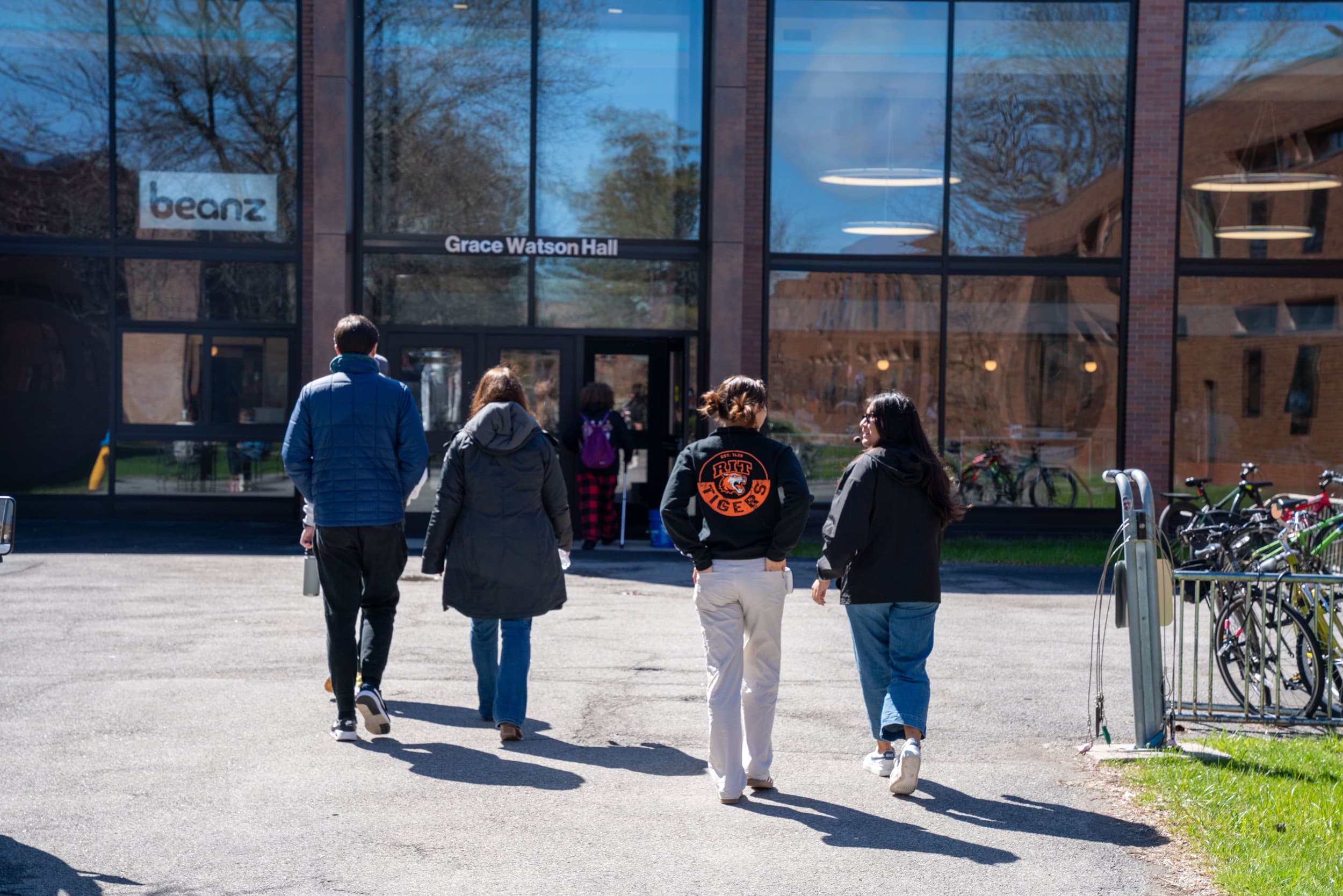 student giving a tour to a family