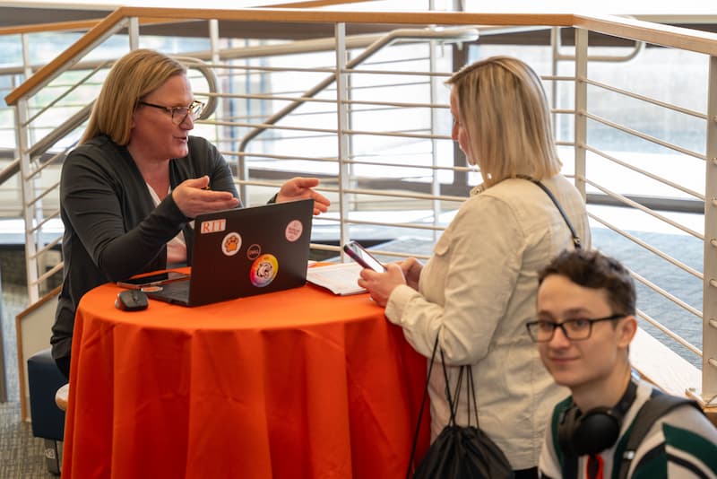 Financial Aid counselor talking to a parent