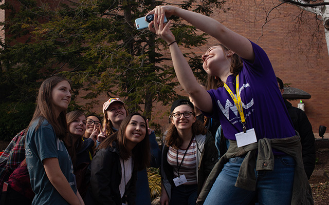 Group of students taking a selfie together