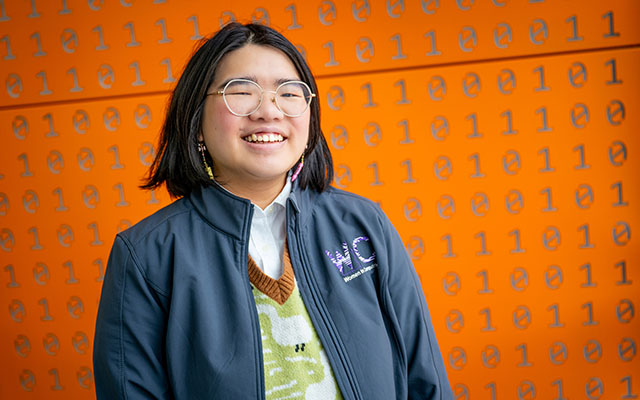 student in Women in Computing jacket 