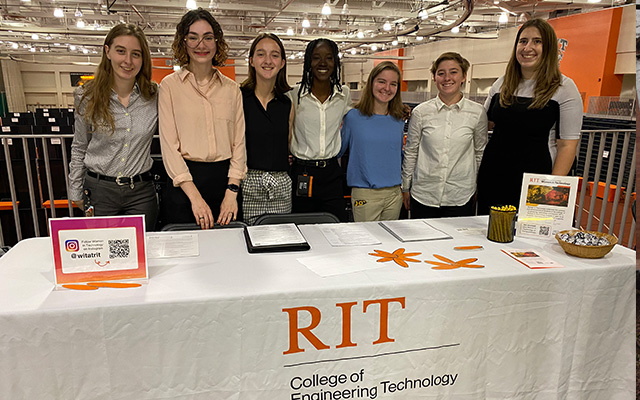 group of students posing in front of table for college of engineering technology
