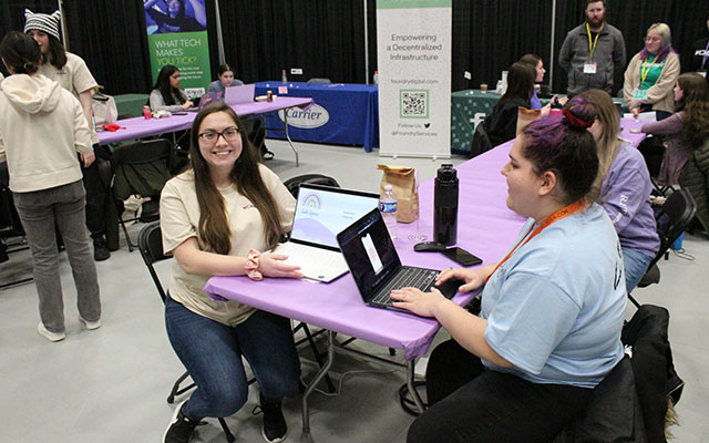 two students at a hackathon