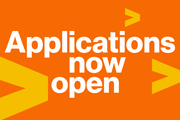 "applications now open" on orange background with yellow greater than signs