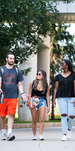 Three students walking together