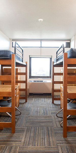 An empty dorm with bunk beds