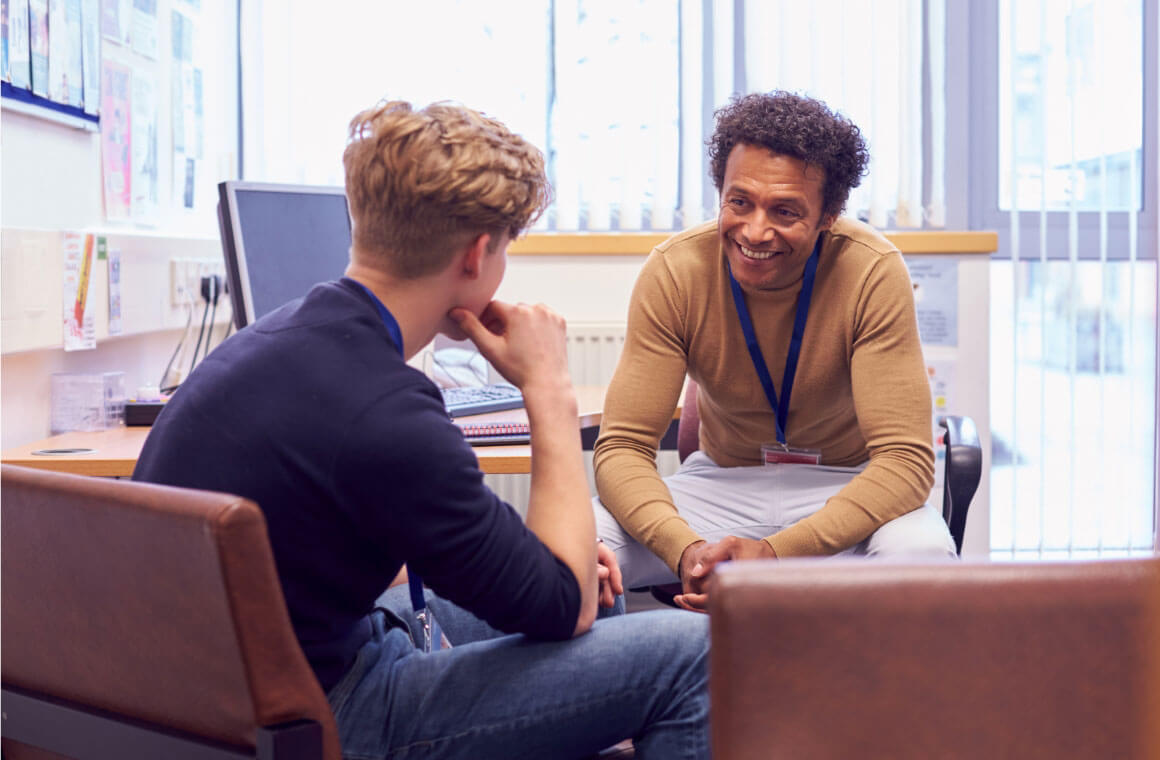 An R I T student talking to a career counselor.