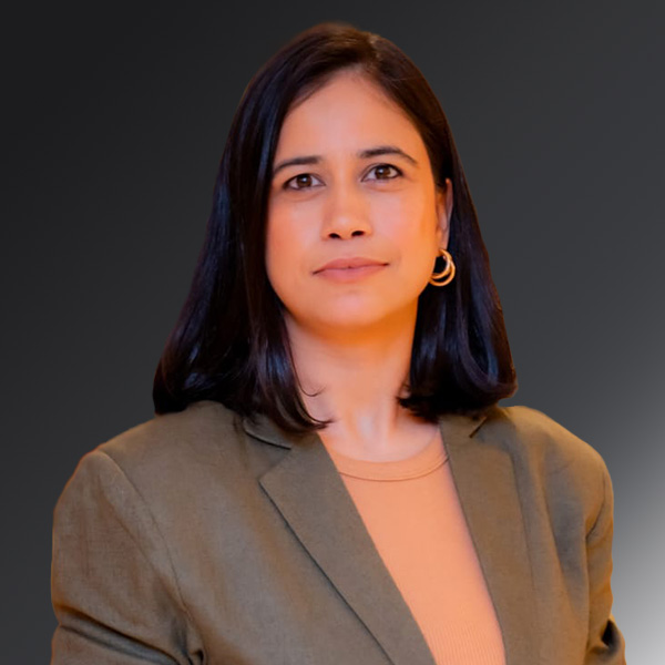 portrait of Pooja Sharma Chettri on a gray background