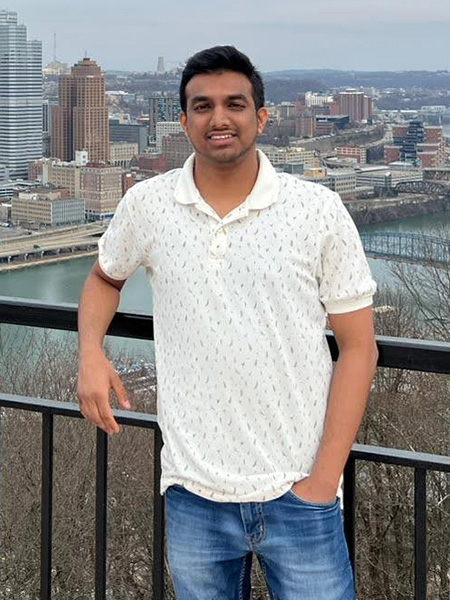 Portrait of student in front of a body of water