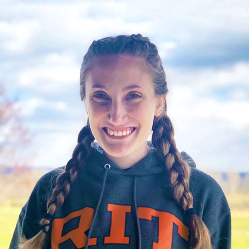 Hannah Hodge headshot wearing an RIT sweater