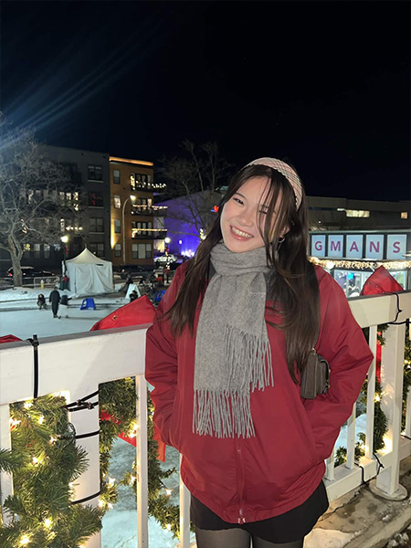portrait of student in red coat
