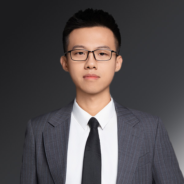 portrait of Peter Wang on a gray background