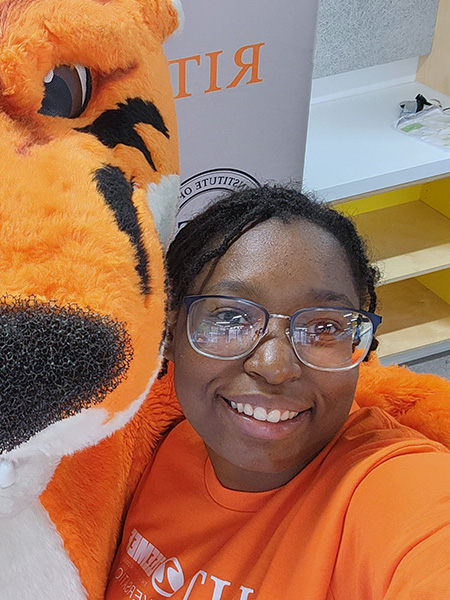 Student selfie with Ritchie, the tiger mascot of R I T