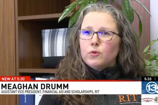 Meaghan Drumm is shown in and office speaking to 13 WHAM news