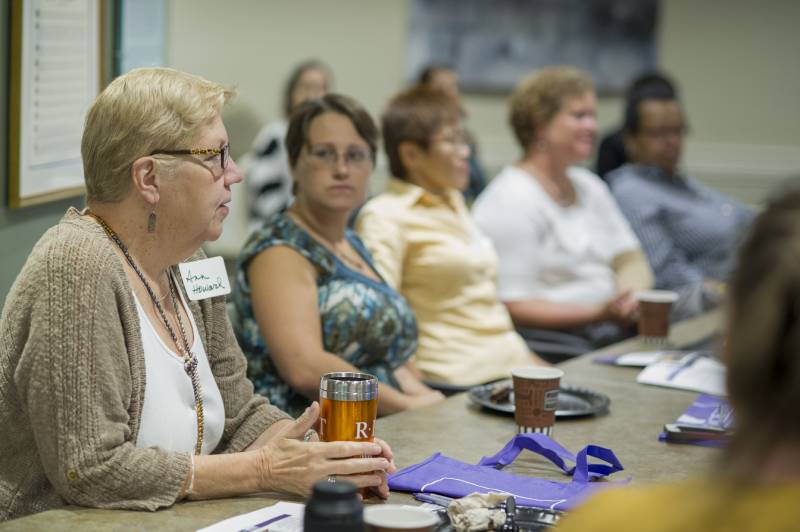 A meeting taking place at a conference table