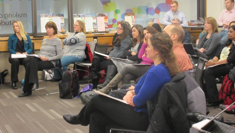 Group meeting while looking at the front of the room