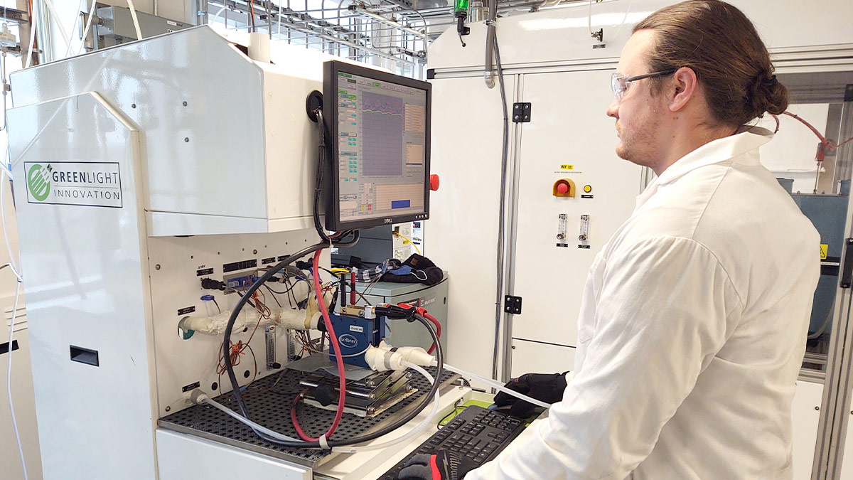 A person looking at the screen display on a piece of equipment.