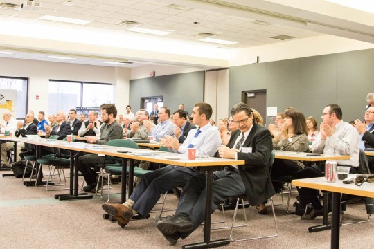 CIMS conference audience clapping.