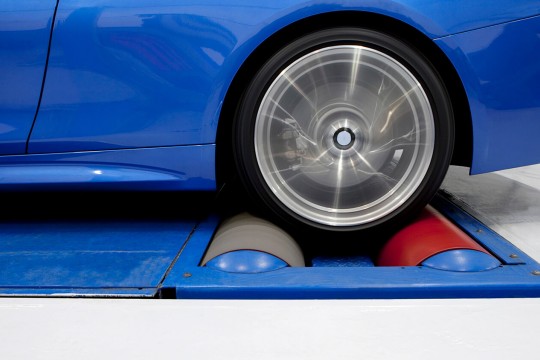 Wheel spinning on a chassis dynamometer.
