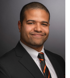 Headshot of a man in a suit