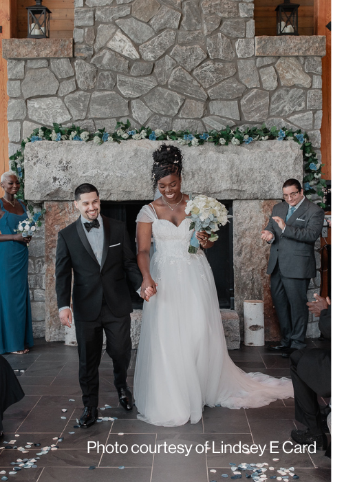 A couple walking down the isle at their wedding